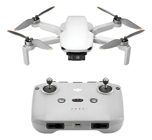Drone DJI Mini 4K compacto na cor cinza em voo pairado no ar